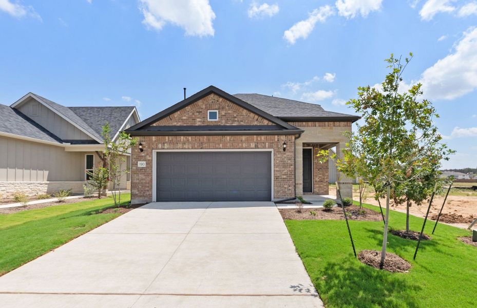 Front exterior of a new home in Del Webb Austin at Lost Pines, Bastrop, TX, highlighting curb appeal (Image 25).