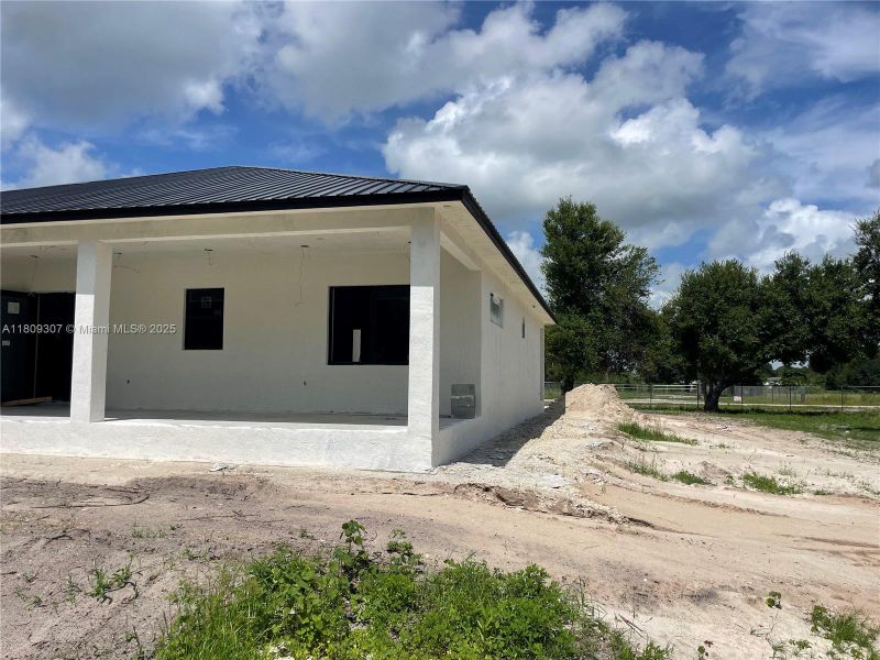 Front exterior of a new home in , Clewiston, FL, highlighting curb appeal (Image 2). Front exterior of a new home in , Clewiston, FL, highlighting curb appeal (Image 2).
