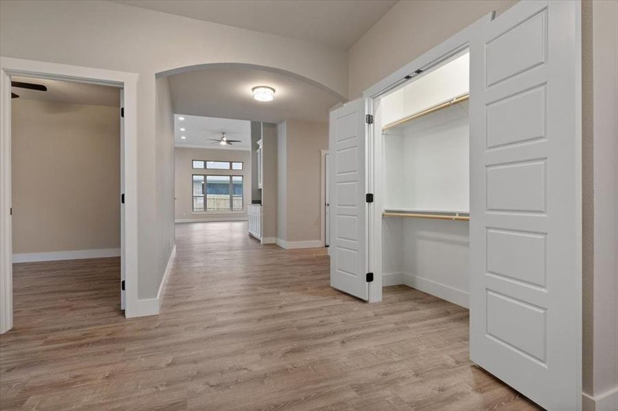 Corridor featuring light hardwood / wood-style floors