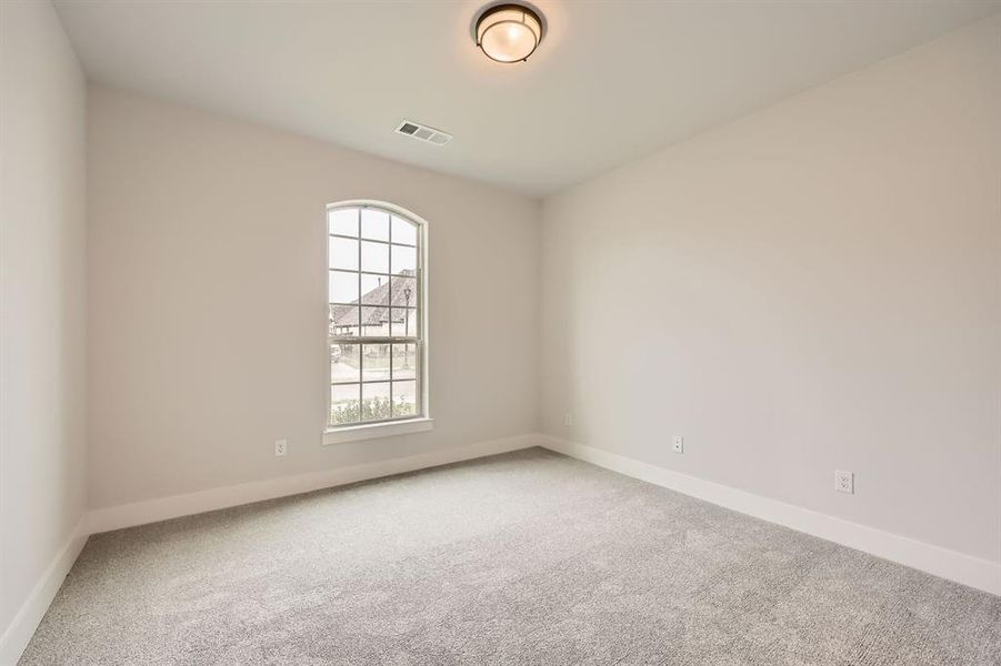 Spare room featuring baseboards, visible vents, and carpet Spare room featuring baseboards, visible vents, and carpet