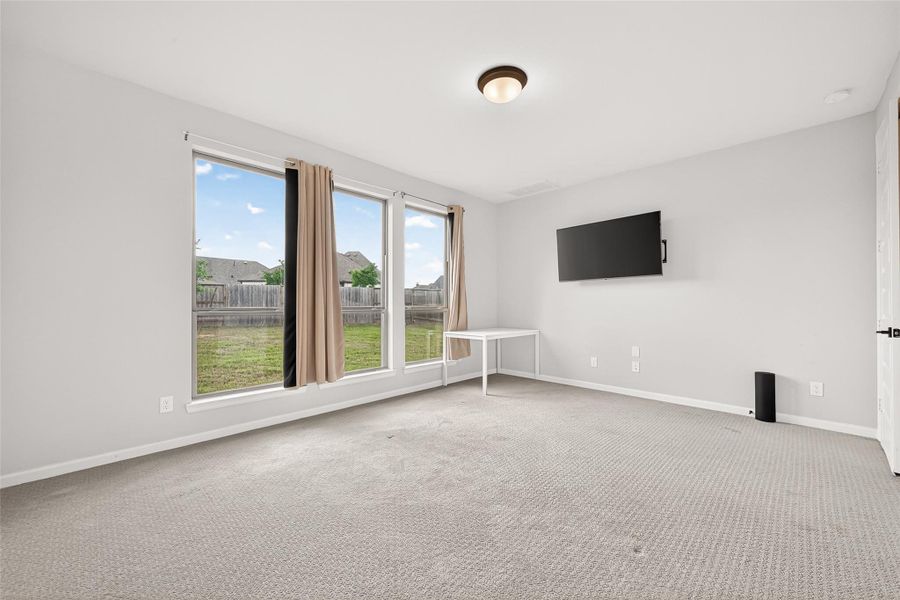 Spacious, unfurnished interior of a new home in Cane Island, Katy (Image 34).