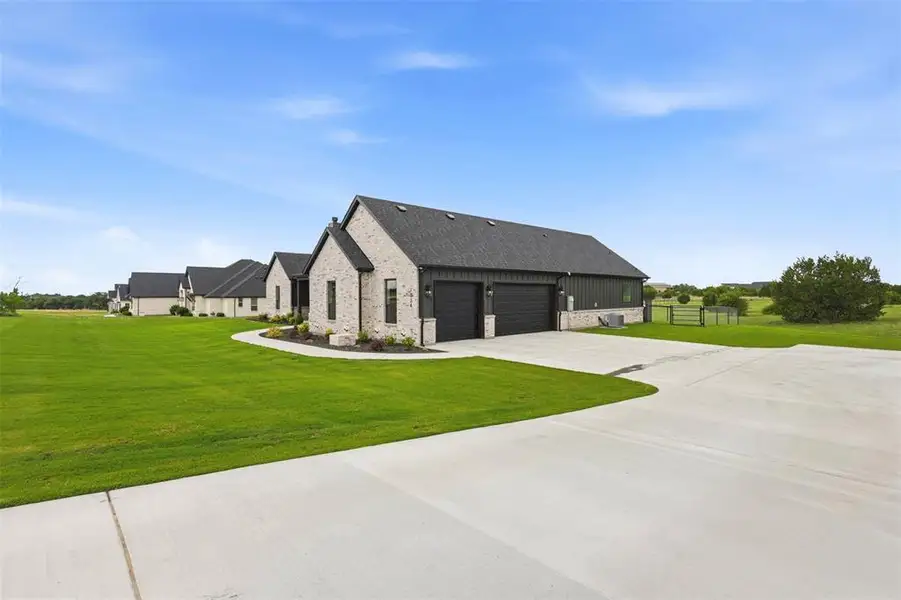 Front exterior of a new home in , Weatherford, TX, highlighting curb appeal (Image 24).