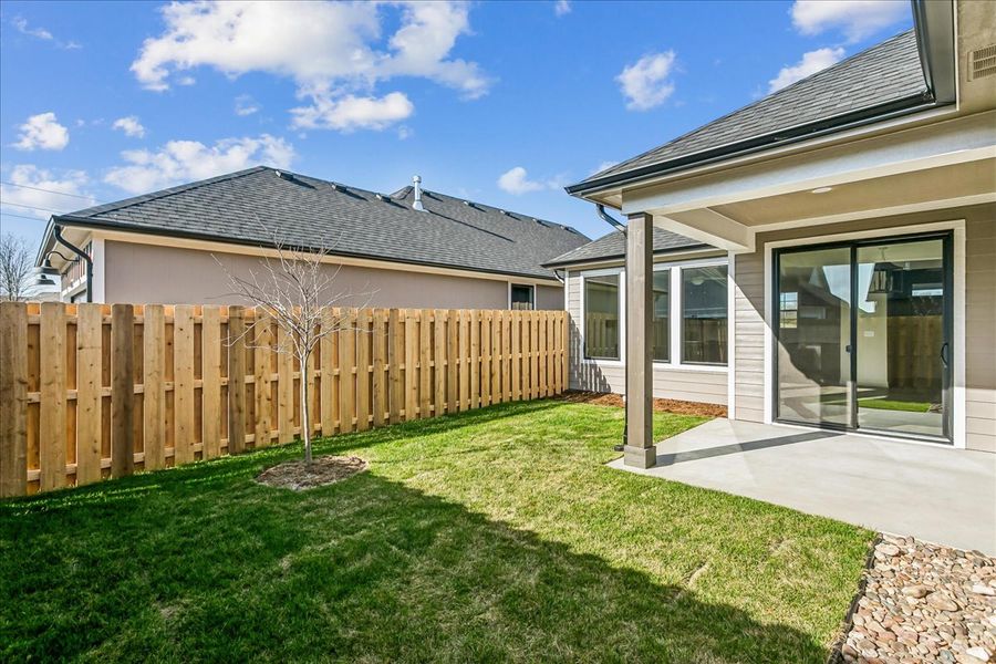Exterior details and patio area of a home in The Courtyards at Jacobs Farm, Wichita (Image 4).