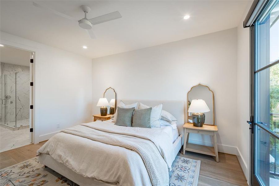 Bedroom featuring ceiling fan and light hardwood / wood-style flooring