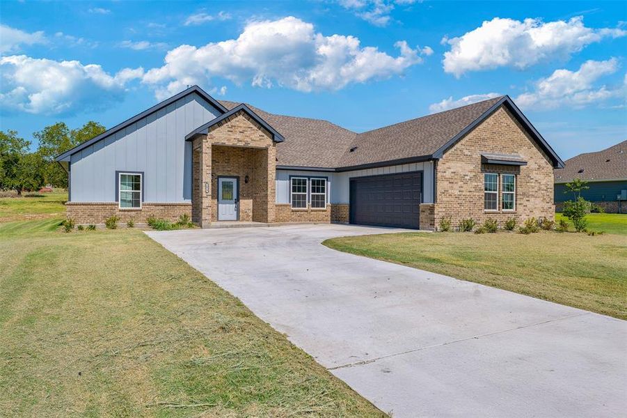 Front exterior of a new home in , Azle, TX, highlighting curb appeal (Image 1).
