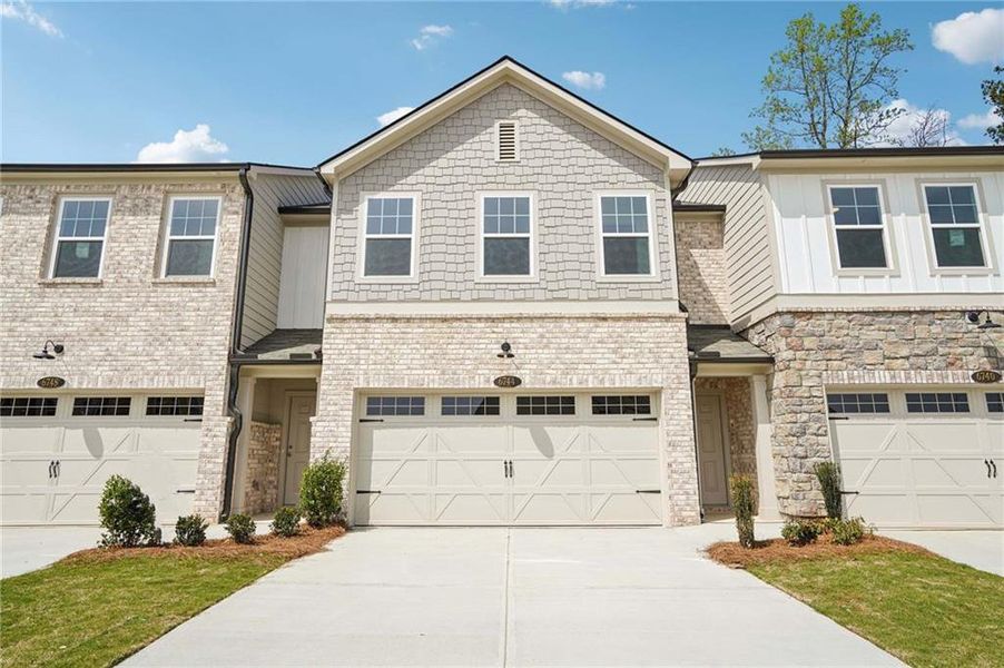 Front exterior of a new home in Leydenview, Mableton, GA, highlighting curb appeal (Image 2). Front exterior of a new home in Leydenview, Mableton, GA, highlighting curb appeal (Image 2).