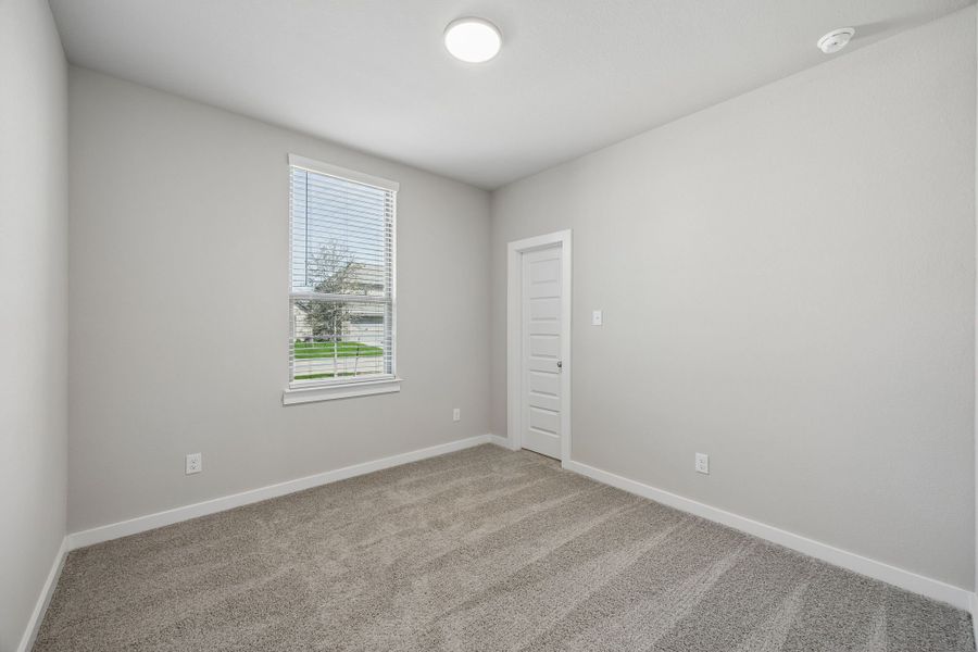 Bedroom in the Emmy II home plan by Trophy Signature Homes - REPRESENTATIVE PHOTO