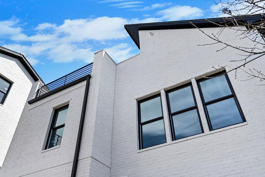 Exterior details and patio area of a home in Spyglass, Austin (Image 28).