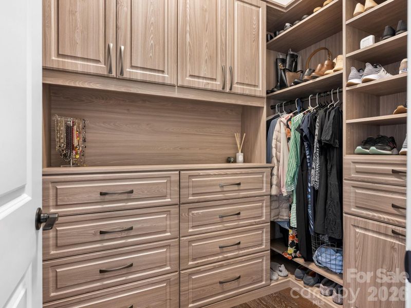 1st Flr, one of two, custom closet systems w/drawers and adjustable shelving.