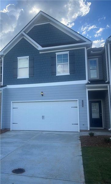 Front exterior of a new home in Fairview Lake Townhomes, Conyers, GA, highlighting curb appeal (Image 2).