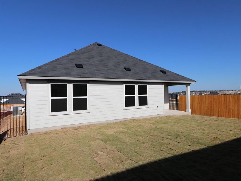 Exterior details and patio area of a home in Cascades at Onion Creek, Austin (Image 1).