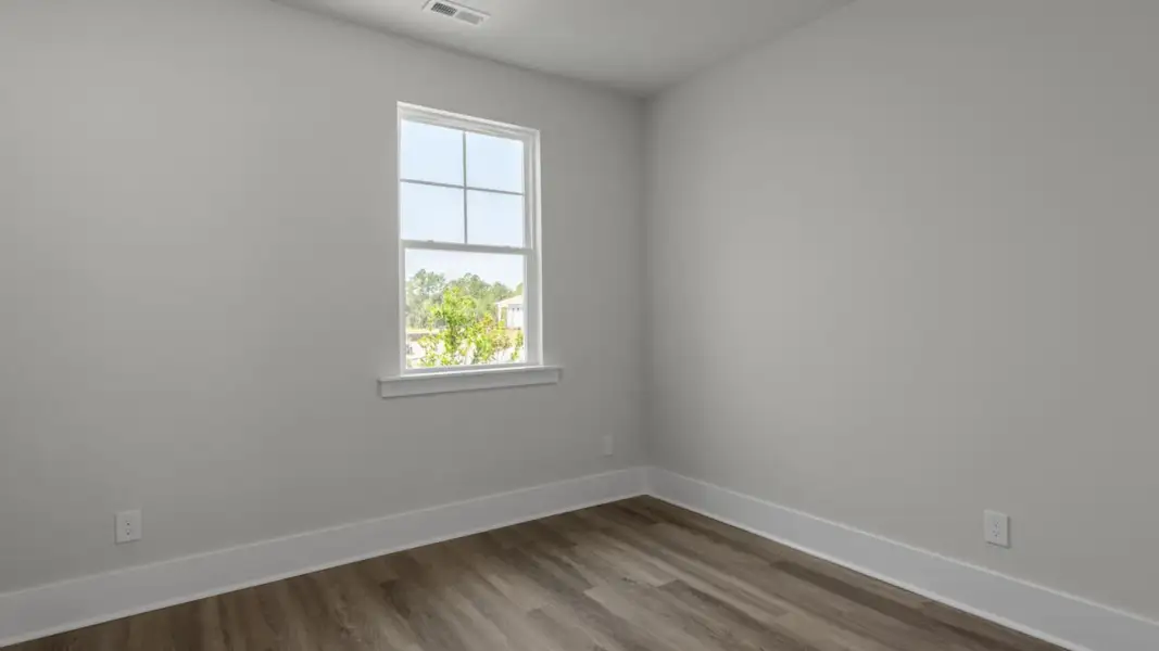 Spacious, unfurnished interior of a new home in The Retreat at Indigo Preserve Townhomes, Leland (Image 23).
