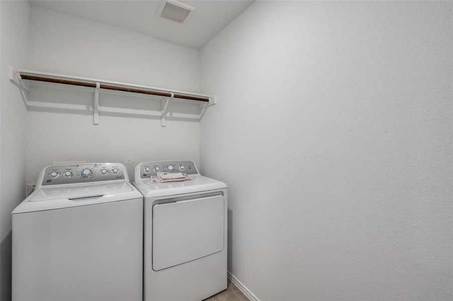 Laundry room with separate washer and dryer