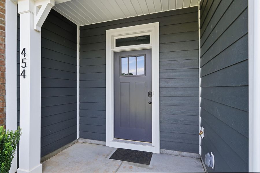 Exterior details and patio area of a home in Blythe Mill Townhomes, Waxhaw (Image 3).