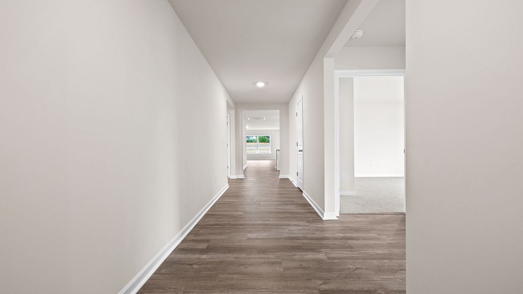 Spacious, unfurnished interior of a new home in Bentley Park, Greenwood (Image 10).