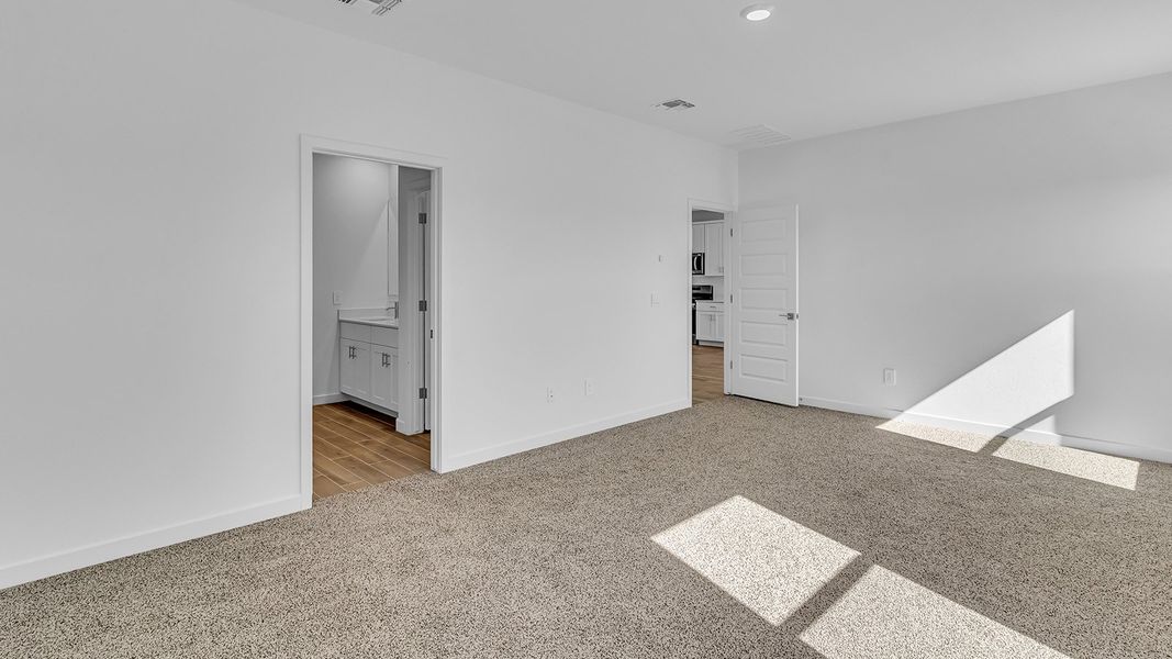 Representative unfurnished interior of a home built from the Harris by D.R. Horton in The Oasis at Rocking K, Vail (Image 36).