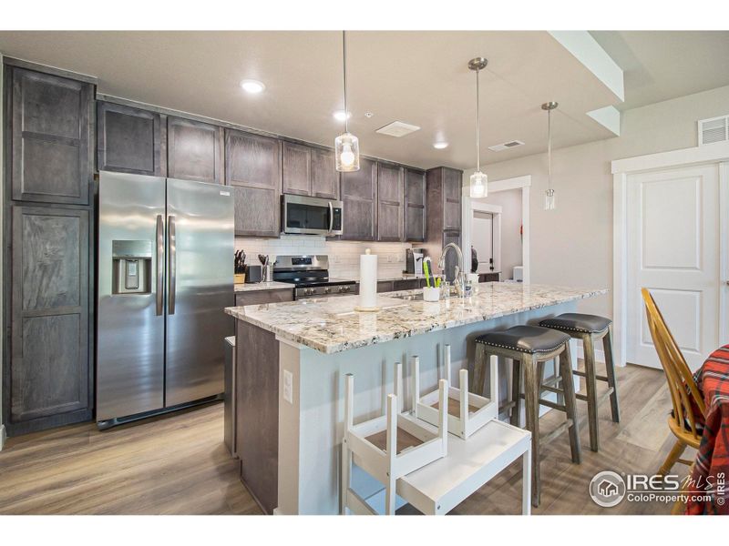 Furnished interior view inside a new home in Highlands at Fox Hill - The Flats, Longmont (Image 5). Furnished interior view inside a new home in Highlands at Fox Hill - The Flats, Longmont (Image 5).