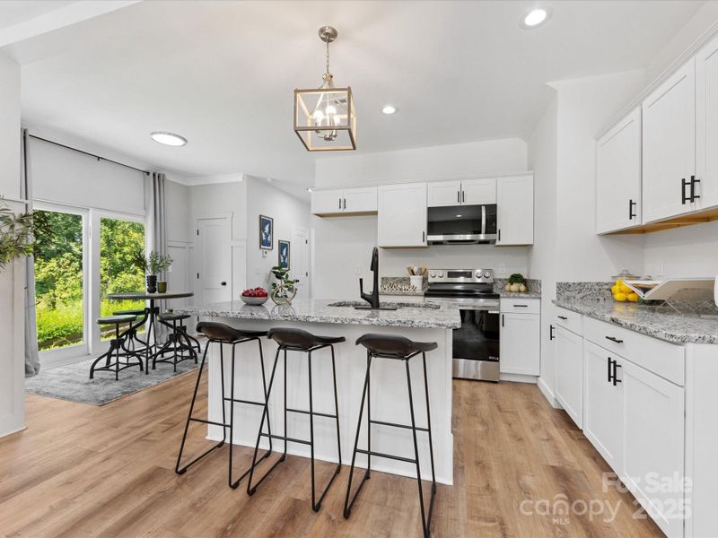 Beautiful kitchen island with additional seating. Beautiful kitchen island with additional seating.