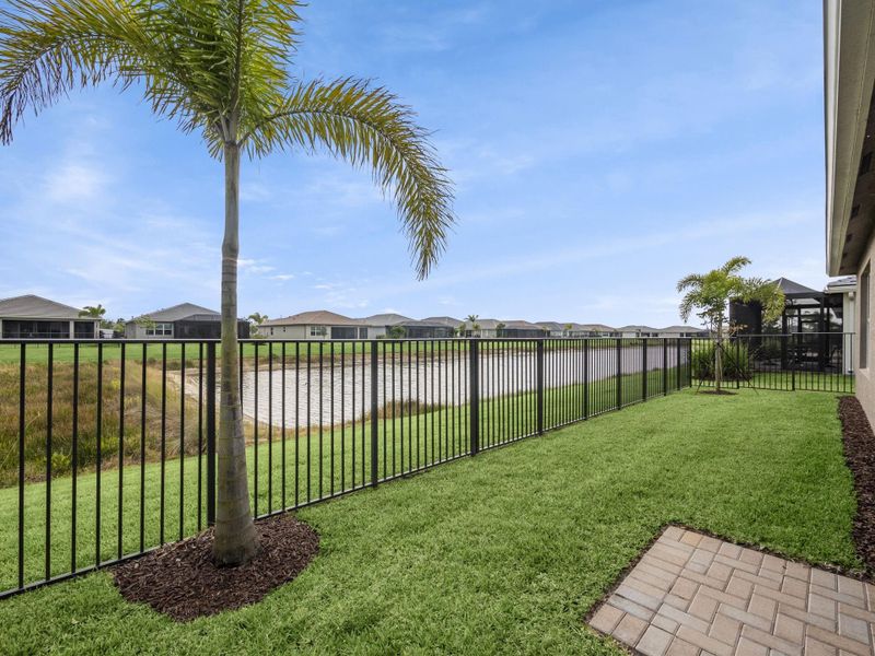 Fence overlooking charming pond.