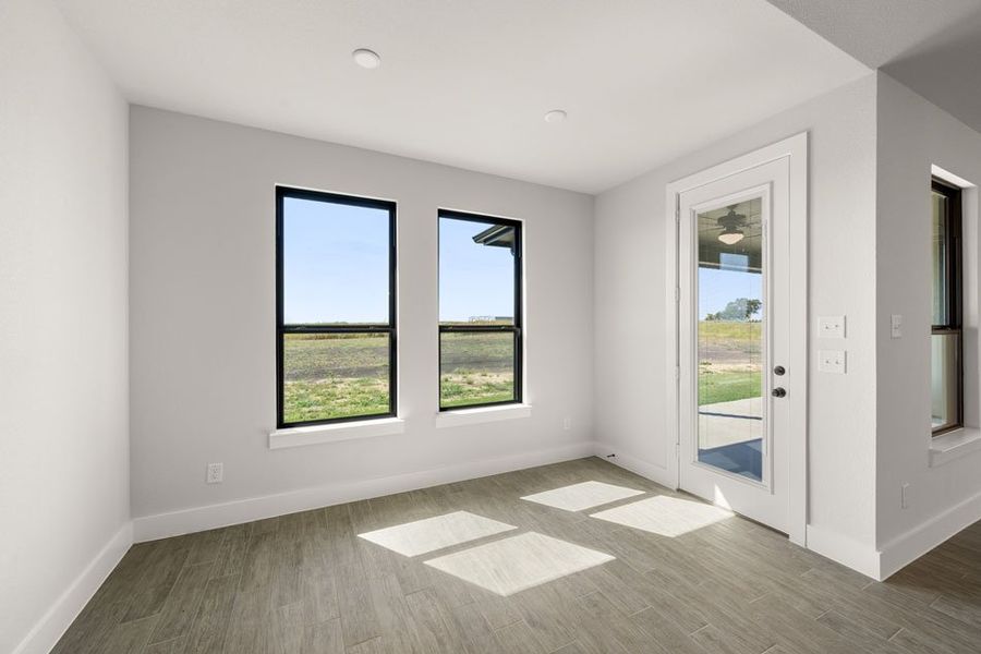 Front exterior of a new home in Carrera Ranch, Waxahachie, TX, highlighting curb appeal (Image 14).