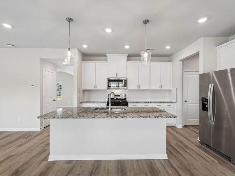 Furnished interior view inside a new home in Northwoods at Mirror Lake, Villa Rica (Image 6).