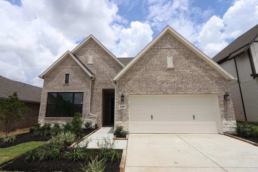 Front exterior of a new home in Kresston, Magnolia, TX, highlighting curb appeal (Image 10).