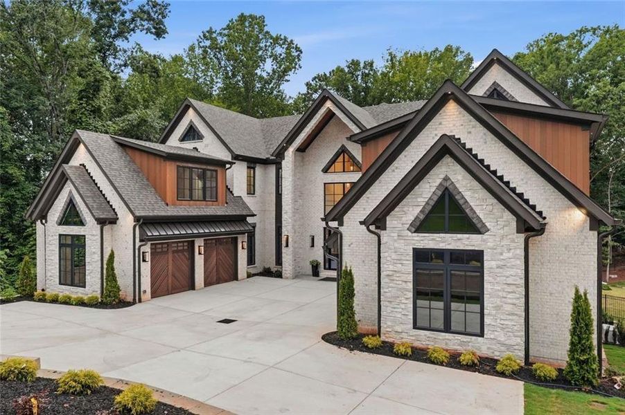 Front exterior of a new home in , Alpharetta, GA, highlighting curb appeal (Image 32). Front exterior of a new home in , Alpharetta, GA, highlighting curb appeal (Image 32).