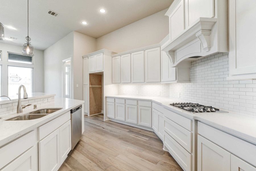 Representative furnished interior of a home built from the 2688 by Ravenna Homes in The Woodlands Hills 65′, Willis (Image 7).