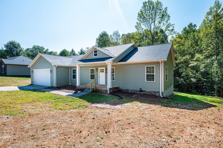 Front exterior of a new home in , Newton, NC, highlighting curb appeal (Image 21).
