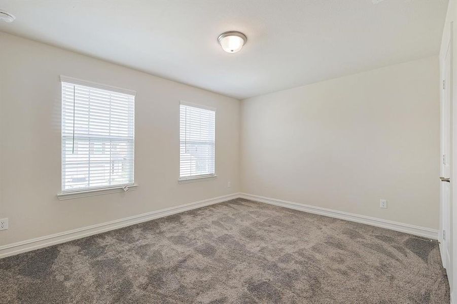 Spare room with carpet floors