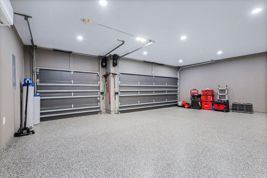 Bright garage area that has  mini split