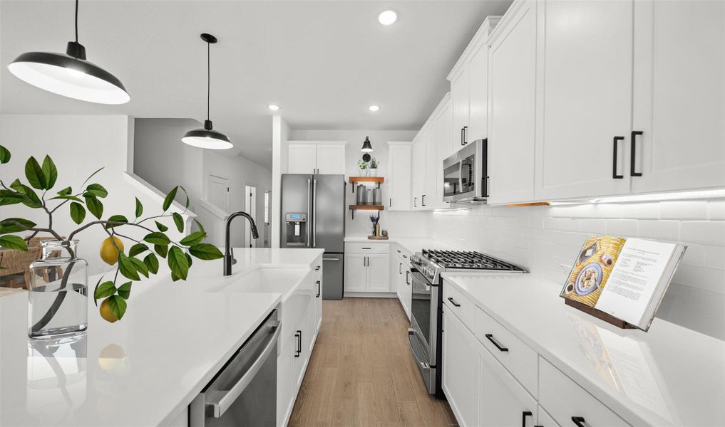 Gourmet kitchen with white cabinets and quartz counters (*Photo not of actual home and used for illustration purposes only.) Gourmet kitchen with white cabinets and quartz counters (*Photo not of actual home and used for illustration purposes only.)