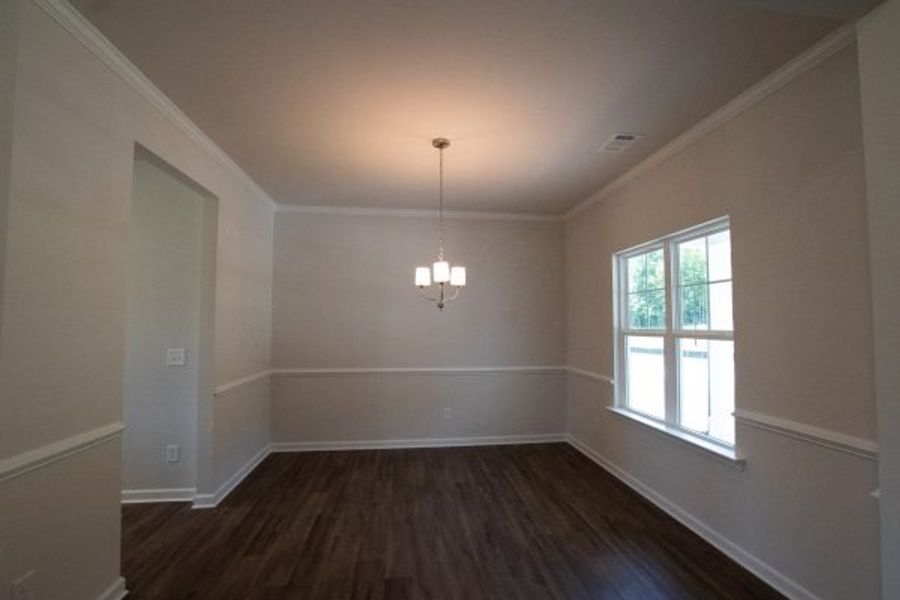 Representative unfurnished interior of a home built from the Fairfax by Piedmont Residential in Falls Creek, Flowery Branch (Image 10).