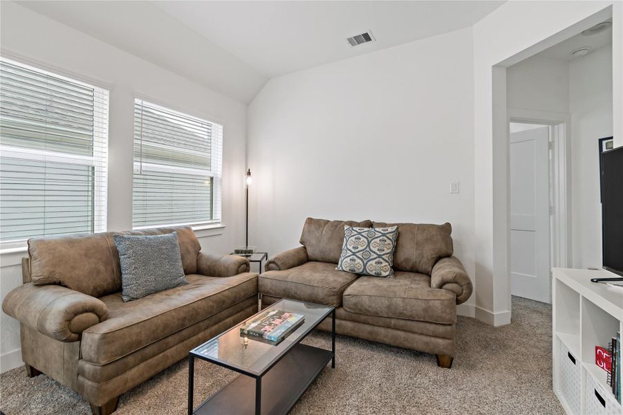 Cozy living space with plush seating and natural light from large windows, perfect for relaxation and entertainment. Cozy living space with plush seating and natural light from large windows, perfect for relaxation and entertainment.