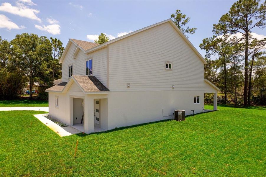 Front exterior of a new home in , Deltona, FL, highlighting curb appeal (Image 23).