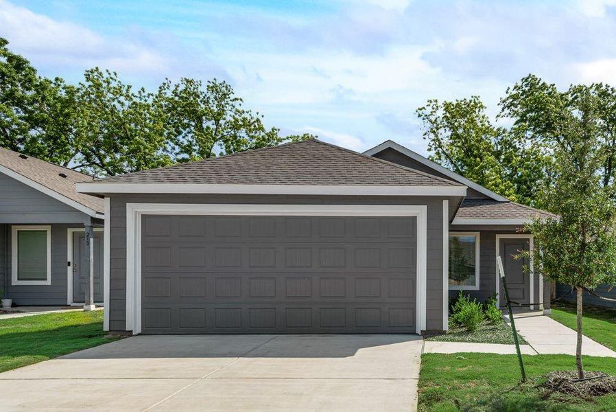Front exterior of a new home in Cottonwood, Wilmer, TX, highlighting curb appeal (Image 2). Front exterior of a new home in Cottonwood, Wilmer, TX, highlighting curb appeal (Image 2).