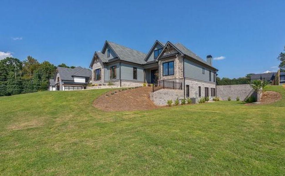 Front exterior of a new home in , Cumming, GA, highlighting curb appeal (Image 26).