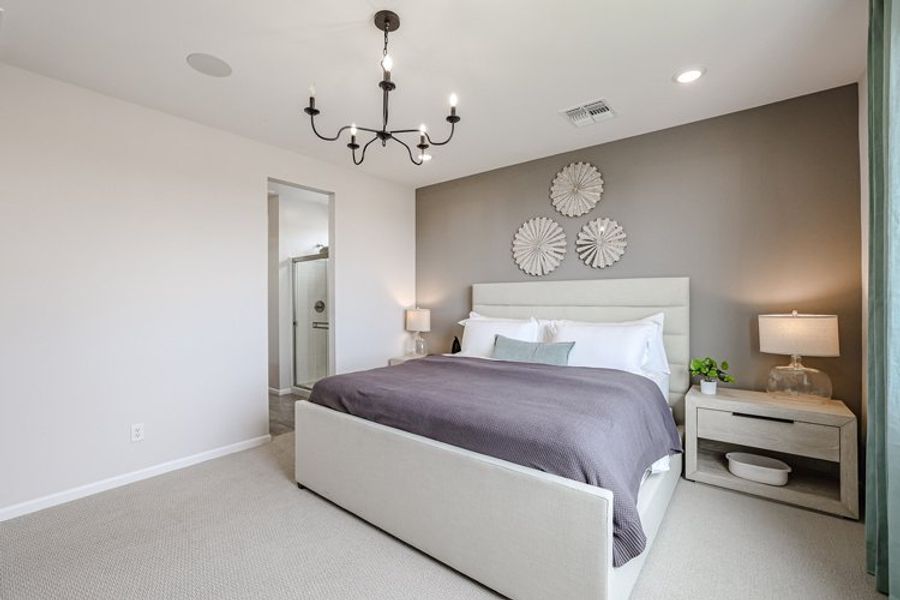 A bedroom with a bed and lamps. A bedroom with a bed and lamps.