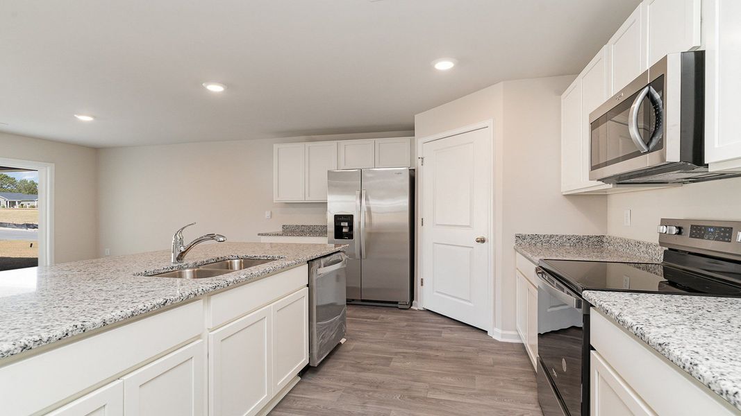 Furnished interior view inside a new home in Stanbury Creek, Supply (Image 7).