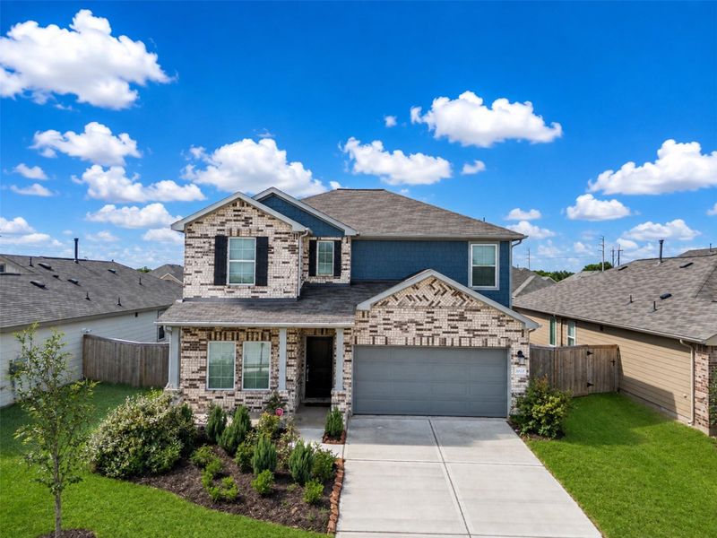 Front exterior of a new home in , La Marque, TX, highlighting curb appeal (Image 23).