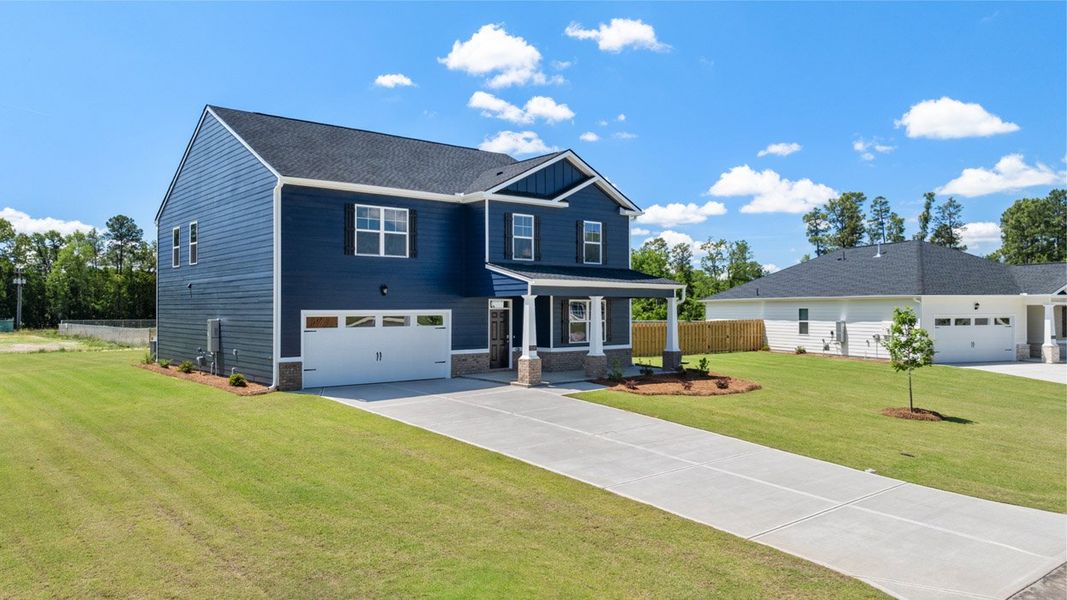 Front exterior of a new home in Southwind Village, Evans, GA, highlighting curb appeal (Image 1).
