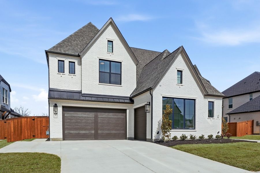 Front exterior of a new home in Light Farms Graham/Reagan, Celina, TX, highlighting curb appeal (Image 25).