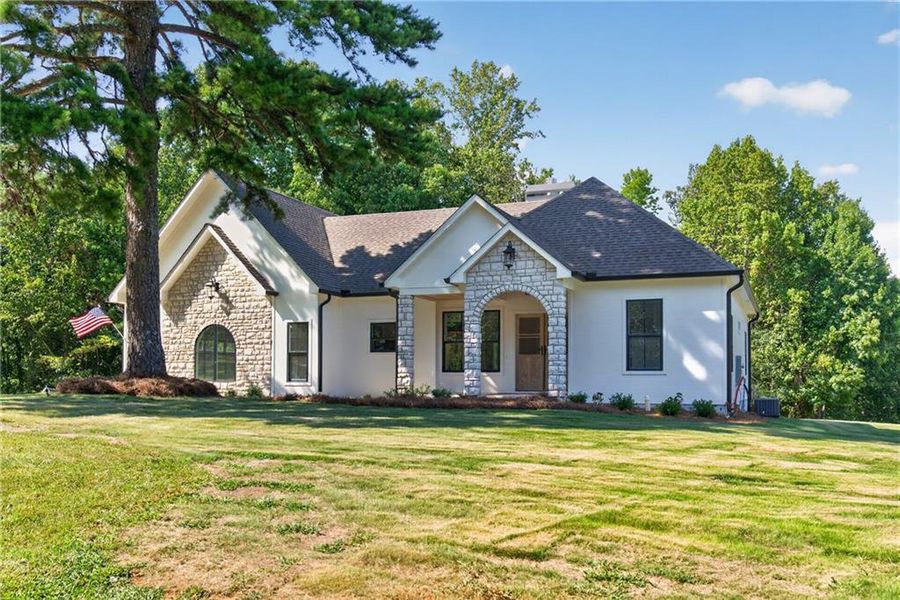 Front exterior of a new home in , Dallas, GA, highlighting curb appeal (Image 22). Front exterior of a new home in , Dallas, GA, highlighting curb appeal (Image 22).