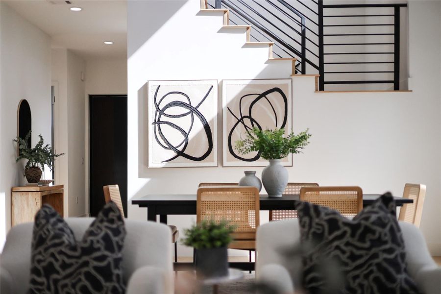 Dining space featuring stairs and recessed lighting