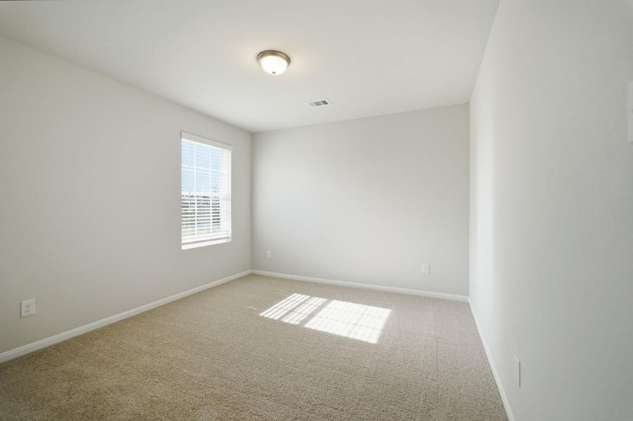 Spacious, unfurnished interior of a new home in The Pines at Seven Coves, Willis (Image 28).