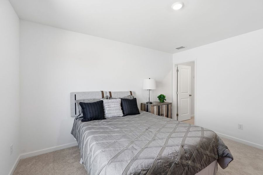 Representative furnished interior of a home built from the Norcross by Taylor Morrison in Windance Lake, Loganville (Image 33).