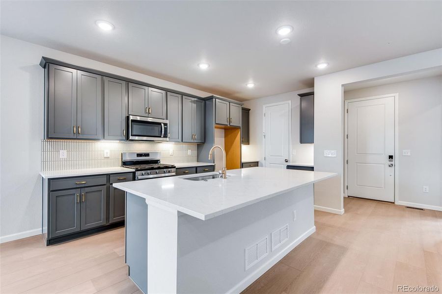 Furnished interior view inside a new home in Painted Prairie, Aurora (Image 5).