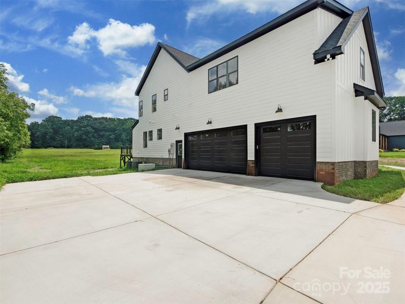 Front exterior of a new home in , Waxhaw, NC, highlighting curb appeal (Image 22).