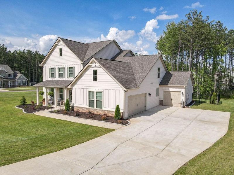 Front exterior of a new home in , Senoia, GA, highlighting curb appeal (Image 30). Front exterior of a new home in , Senoia, GA, highlighting curb appeal (Image 30).