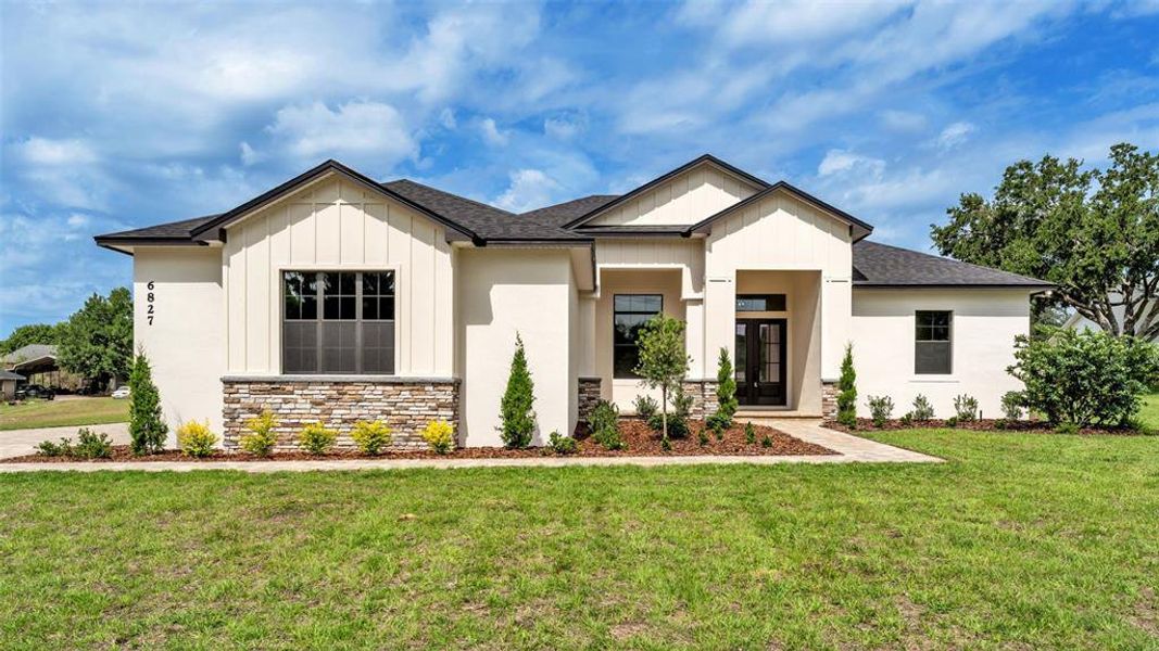 Front exterior of a new home in , Lakeland, FL, highlighting curb appeal (Image 27).